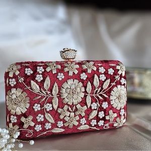 Maroon velvet hand embroidered clutch.